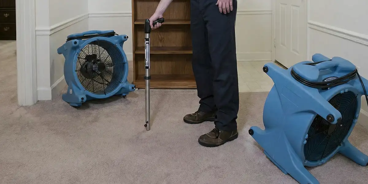 emergency water removal equipment deployed to dry a flooded residential interior in Des Moines, IA