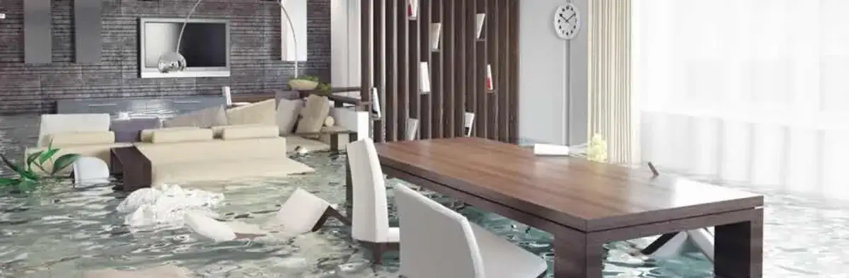 home interior affected by water damage with flooded floors and displaced furniture in Des Moines, IA